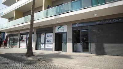 a facade of a building with glass doors on it at Geams Sal Suite in Santa Maria
