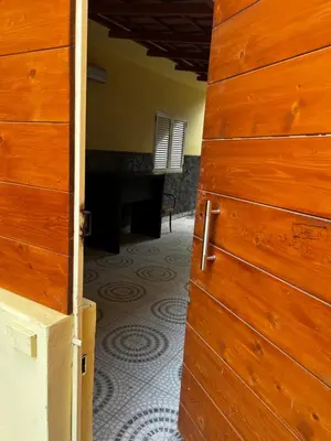 an open door to a room with a floor at Beira Mar AB2 in Santa Maria