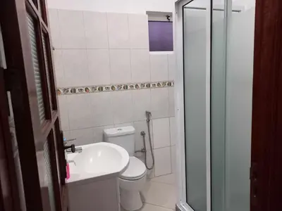 a small bathroom with a toilet and a sink at Black Diamond - CASA Tia Bia in Ribeira Grande