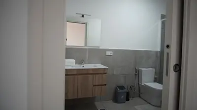 a bathroom with a sink and a toilet and a mirror at Atlantico Sal Apt in Santa Maria