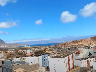 a view of a city with buildings and the ocean at SILVAs Apartment in Mindelo