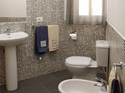 a bathroom with a white toilet and a sink at Apartment in Sal Rei - Boa Vista in Sal Rei