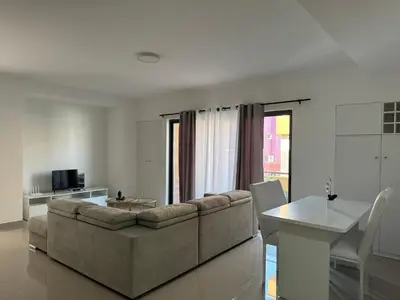 a living room with a couch and a table at Holiday Apartments TF in Praia