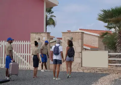 a group of people standing outside of a building at Appartamento Ferreira Stella Maris Exclusive in Calheta Do Maio