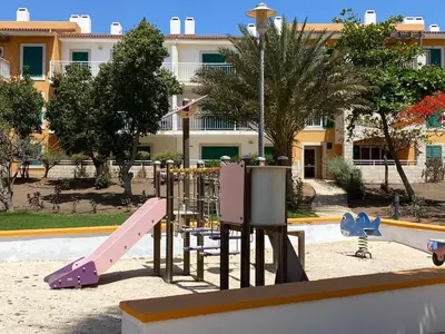 a playground in a park with a slide at Mi Casa és Su Casa in Prainha