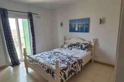 a bedroom with a bed and a window at SUNNY Apartment - SAL VILA VERDE - Cabo Verde in Santa Maria