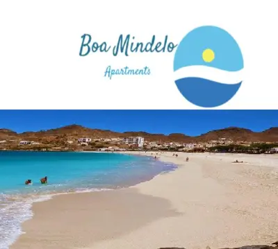 a picture of a beach with people in the water at Boa Mindelo Beach in Mindelo