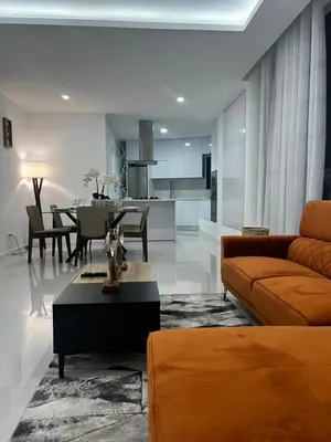 a living room with a couch and a table at ROYAL PALMAREJO APPARTAMENTO in Praia