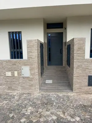a front door of a building with a walkway at NEW Luxury Condo - In the heart of Santa Maria in Santa Maria