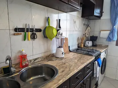 a kitchen counter with a sink and a mixer at Apartment Funana Tarrafal in Tarrafal