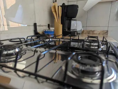 a stove top with a bunch of burners on it at Apartment Funana Tarrafal in Tarrafal