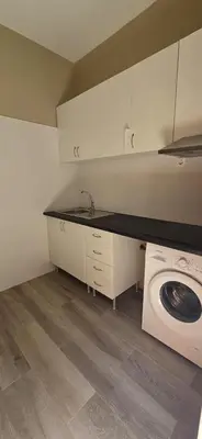 a kitchen with a washer and a washing machine at City Center Mindelo 39 in Mindelo