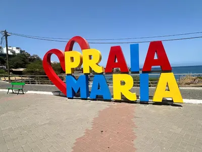 a sign for arapah marina on the beach at Apartamento Batuku in Praia