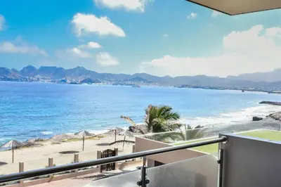 a view of the beach from a balcony at Duarte Apartments - Las Rochas in Mindelo