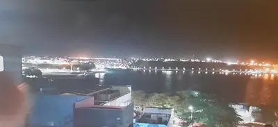 a view of a body of water at night at Gamboa-2 Praia in Praia