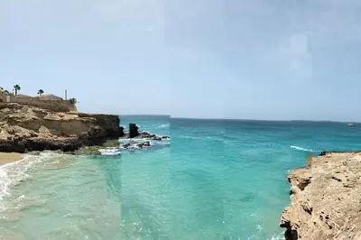 a view of the ocean from a rocky beach at Villa 4 Stella Maris - Ilha do Maio in Vila do Maio