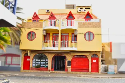 a model of a house with red doors at Santa Maria Homely Flat in Santa Maria