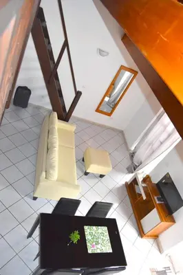 a living room with a couch and a table at Santa Maria Homely Flat in Santa Maria