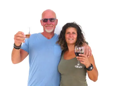 a man and a woman holding a glass of wine at Hotel MiraBela in Santa Maria