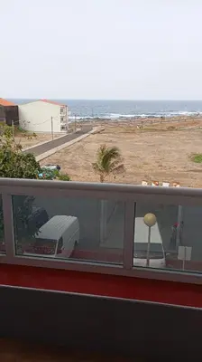 a balcony with a view of the beach and the ocean at Edu Horizonte in Calheta de São Miguel