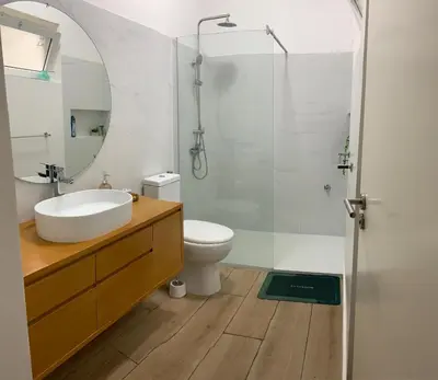 a bathroom with a sink and a toilet and a shower at Flat Mindelo 30 in Mindelo