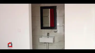 a bathroom with a sink and a mirror at Guest House Lina Elisa in Mindelo