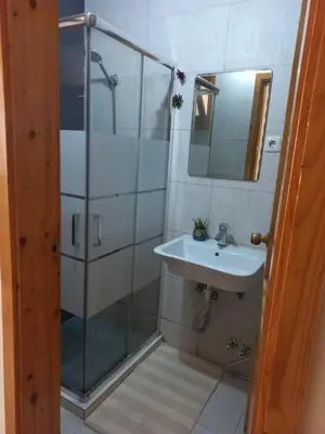 a bathroom with a shower and a sink at Brisa e Paz in Praia