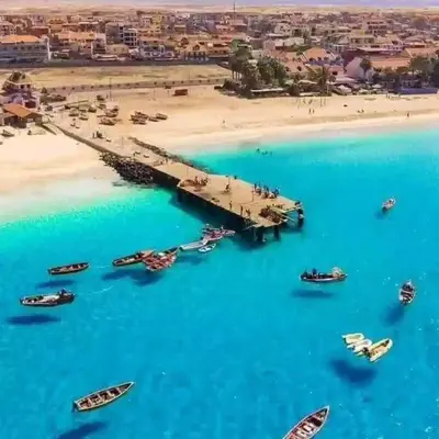an aerial view of a beach with boats in the water at Mota Residência in Santa Maria