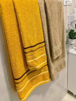 a group of towels hanging in a bathroom at Apartamento Paradise in Santa Maria