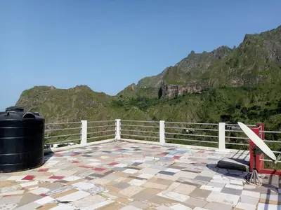 a deck with a view of a mountain at SANDRO Paul Residenciel in Paul