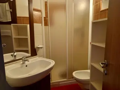 a bathroom with a sink and a toilet at Appartamento t0 n 7 situato complesso turistico porto antico 2 in Santa Maria