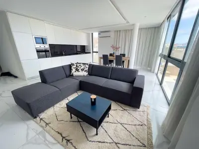 a living room with a couch and a table at Bliss Apartments T2 - Julia in Mindelo