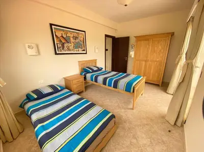 a bedroom with two beds in a room at Surf House - Your Exclusive Getaway in Palmeira