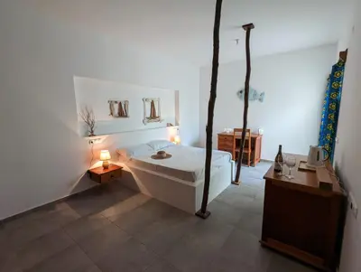 a bathroom with a bath tub in a room at Vila de Matiz in Vila do Maio