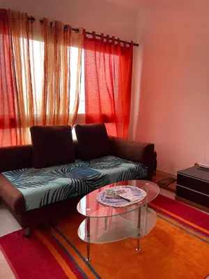 a living room with a couch and a glass table at Apartamento Rua do museu dos Náufragos in Sal Rei