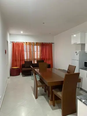 a kitchen and dining room with a table and chairs at Apartamento Rua do museu dos Náufragos in Sal Rei