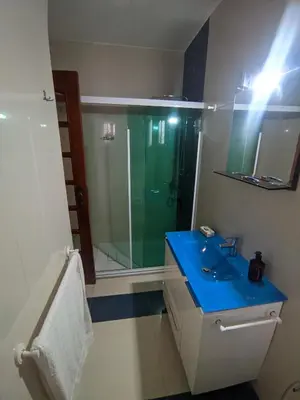 a bathroom with a blue sink and a shower at Casa TIANA in Mindelo