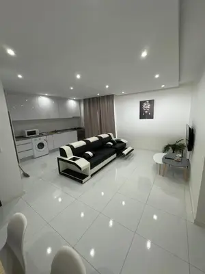 a living room with a couch and a table at Nikita in Praia