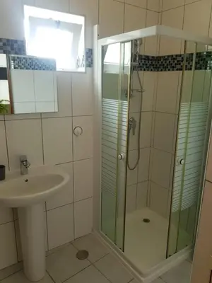 a bathroom with a shower and a sink at Residencia Solimar in Ponta do Sol