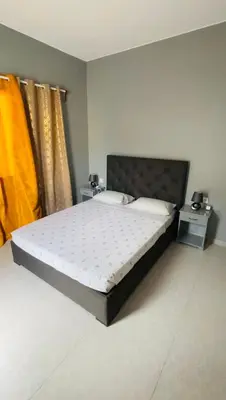 a bedroom with a large bed in a room at Hostel Rocha Marisol in Ponta do Sol