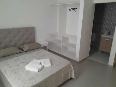 a bedroom with a bed with two towels on it at Hostel Rocha Marisol in Ponta do Sol