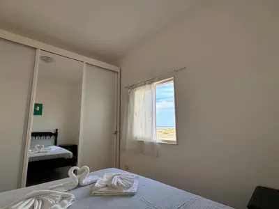 a bedroom with a bed with towels on it at Sea view - Ca Mauro - Praia Cabral - Wi-Fi in Sal Rei