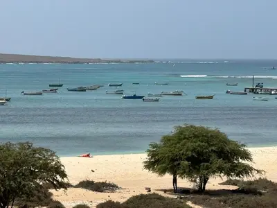 a group of boats in the water on a beach at Sea view - Ca Mauro - Praia Cabral - Wi-Fi in Sal Rei