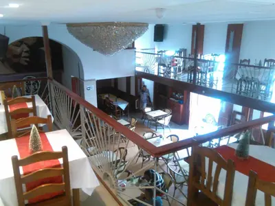a view of a living room and dining room at Royal Mindelo Suite in Mindelo