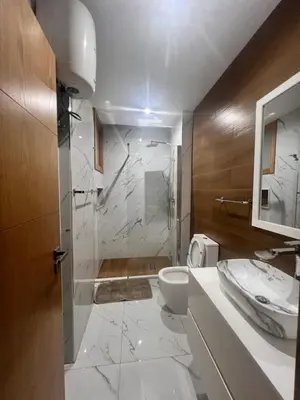 a bathroom with a toilet and a sink at Ondas Relax House in Praia