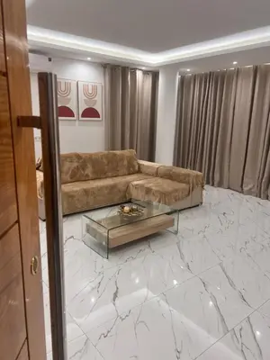a living room with a couch and a table at Ondas Relax House in Praia