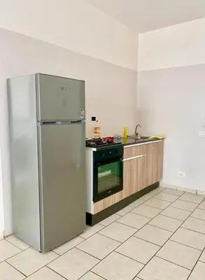 a kitchen with a stainless steel refrigerator and a stove at Vista di mare in Sal Rei