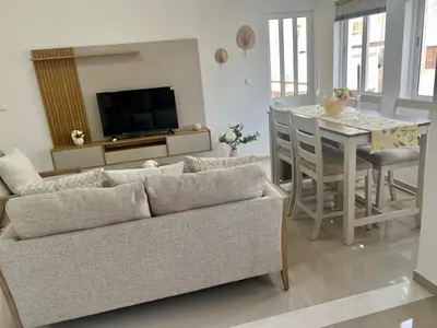 a living room with a couch and a table at Apartamento Moderno in Mindelo
