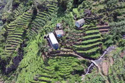 an aerial view of a farm with vehicles on a field at Alfa-apartamento in Pombas