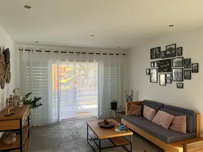 a living room with a couch and a table at Casa Branca in Ponta do Sol